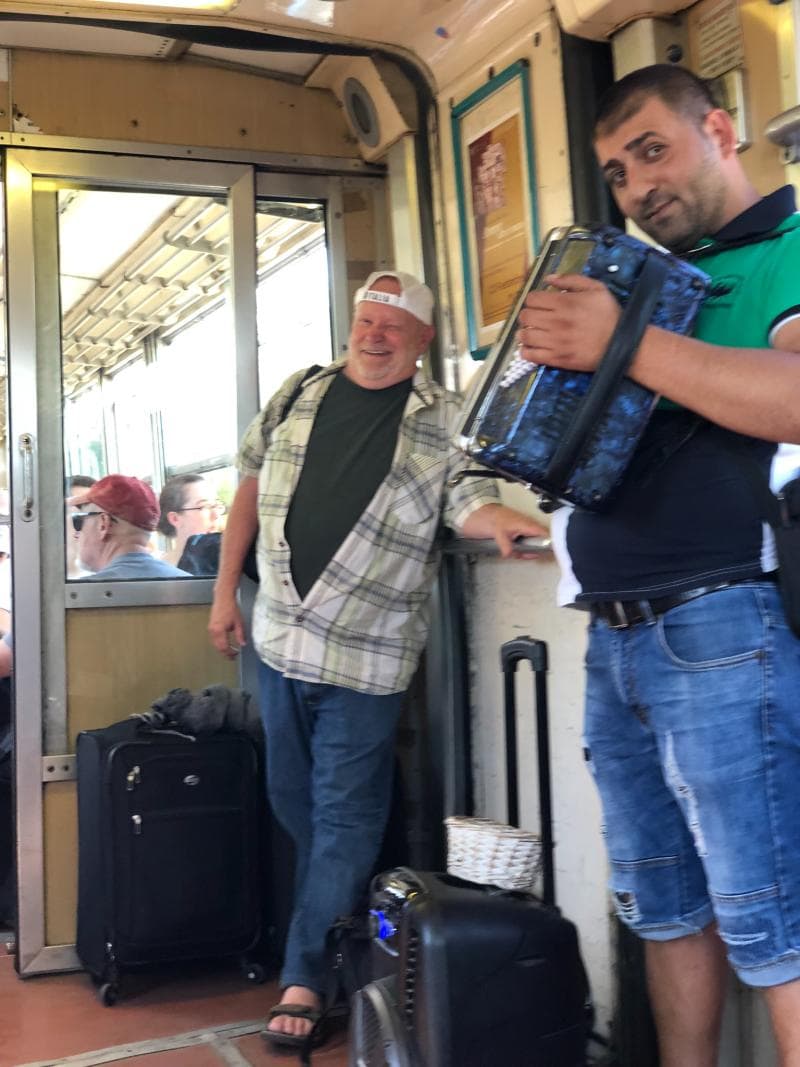 Carry-on luggage on a train to Sorrento showing why smaller bags are easier for European travel