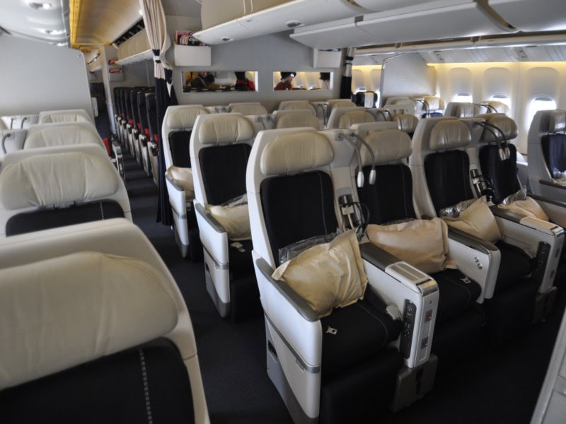 Premium economy cabin on a Boeing 777 featuring wider seats, additional legroom, and enhanced comfort for long-haul international flights.