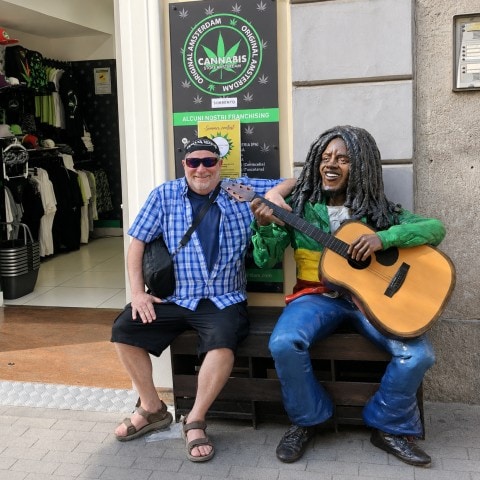 Traveler posing with a Bob Marley statue in Sorrento, Italy