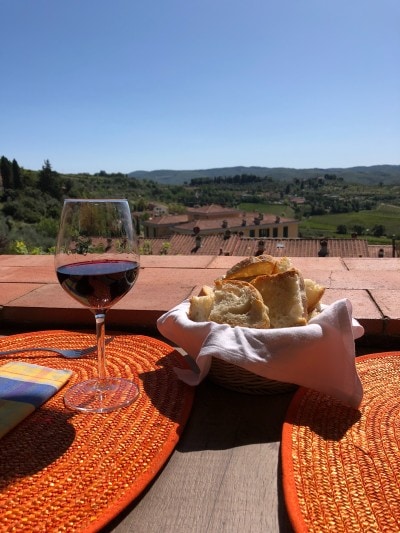 Lunch with wine overlooking the rolling hills of Tuscany, Italy