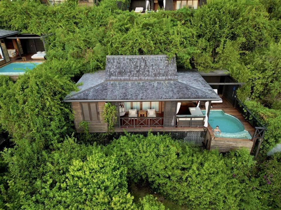 Aerial view of a Hillside Garden Pool Villa at Hermitage Bay Antigua featuring a private plunge pool surrounded by lush tropical vegetation.