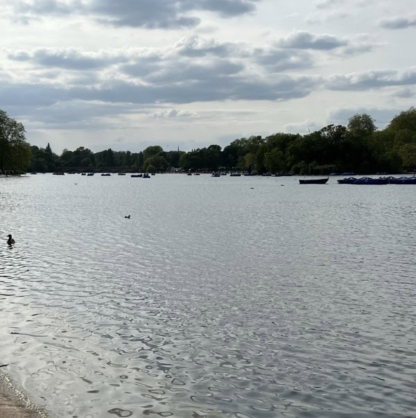 View across the Serpentine Lake in Hyde Park, one of London's most popular green spaces