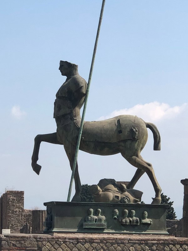 Centauro sculpture by Igor Mitoraj displayed among the ruins of Pompeii, Italy