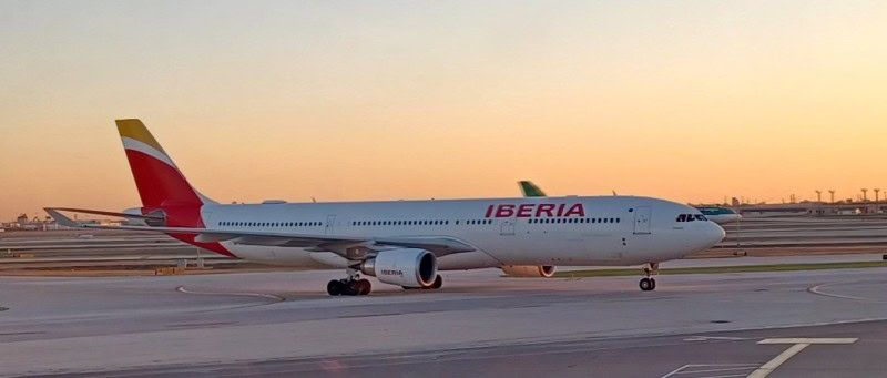 Iberia aircraft on the tarmac, representing international business class award travel to Europe using airline miles and points.
