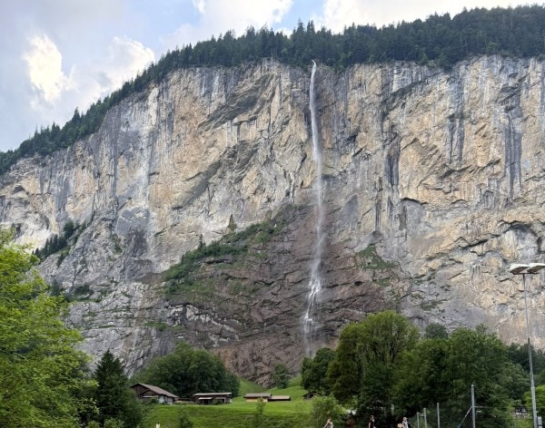 Waterfall cascading down the cliffs of Lauterbrunnen Valley in Switzerland.