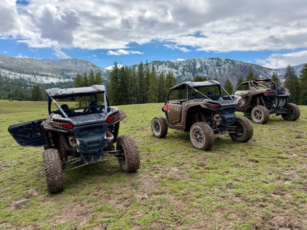 Guests enjoying a Polaris UTV off-road adventure at RiverView Ranch Retreat & Western Adventures in Montana, an all-inclusive luxury guest ranch bookable with Hilton Honors points.