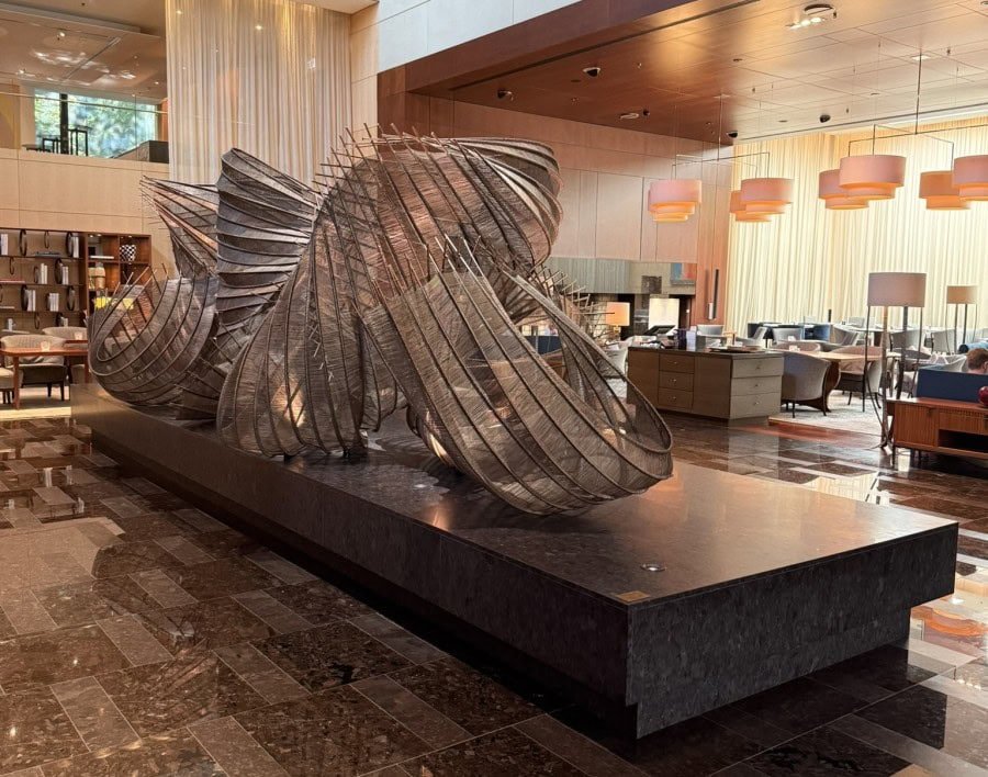 Contemporary lobby of the Park Hyatt Zurich featuring modern artwork, elegant seating, and a welcoming atmosphere.