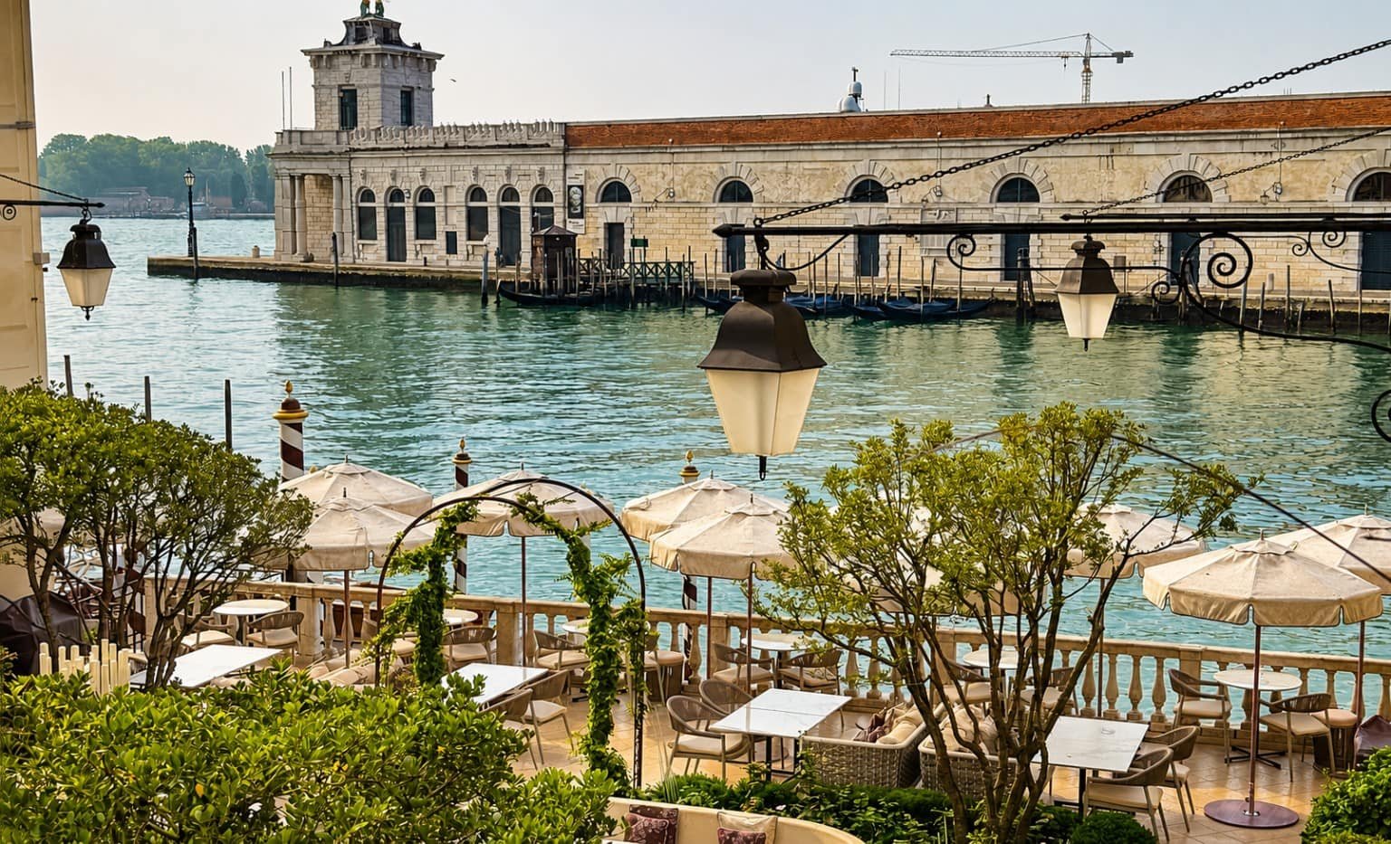 View from a Venice hotel overlooking the Grand Canal, with a waterfront terrace and historic architecture illustrating how location and views enhance the travel experience.