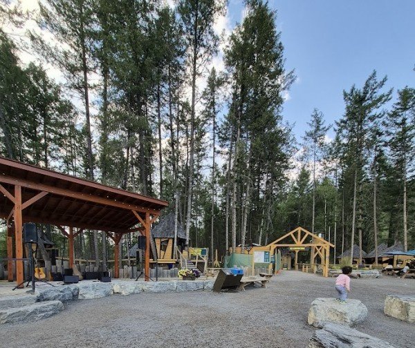 Golden Skybridge outdoor entertainment area with live music stage and seating in Golden, British Columbia