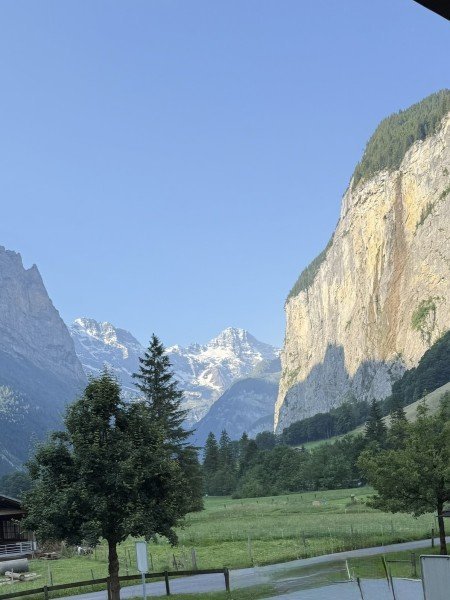 Lauterbrunnen valley and sunlit cliff viewed from our deck