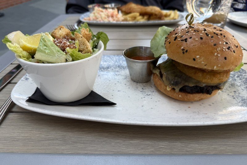 Bison burger with Caesar salad at The Maple Leaf in Banff