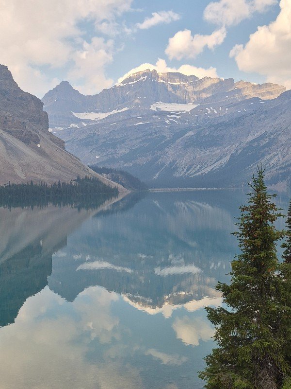 Cloud and mountain reflections on Bow Lake