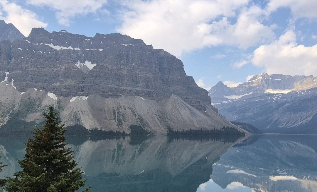 Panoramic mountain reflections on Bow Lake along the Icefields Parkway