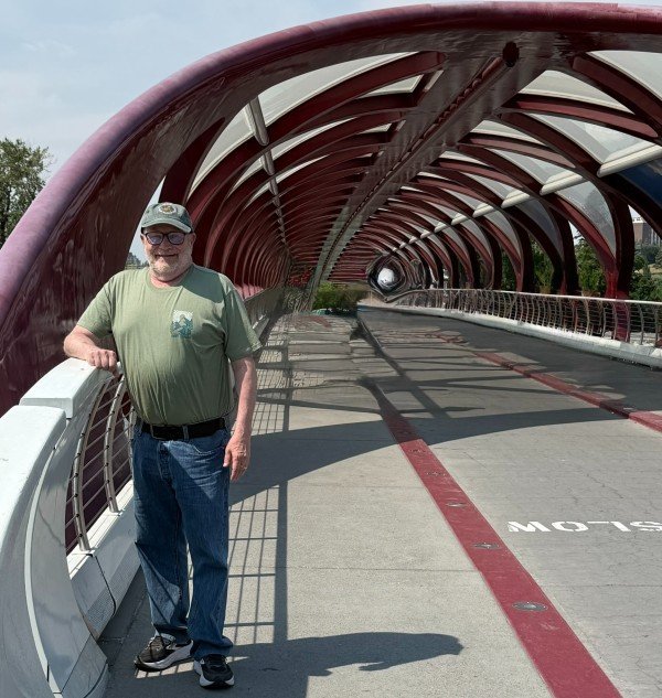 Traveler walking across the Peace Bridge in Calgary, Alberta
