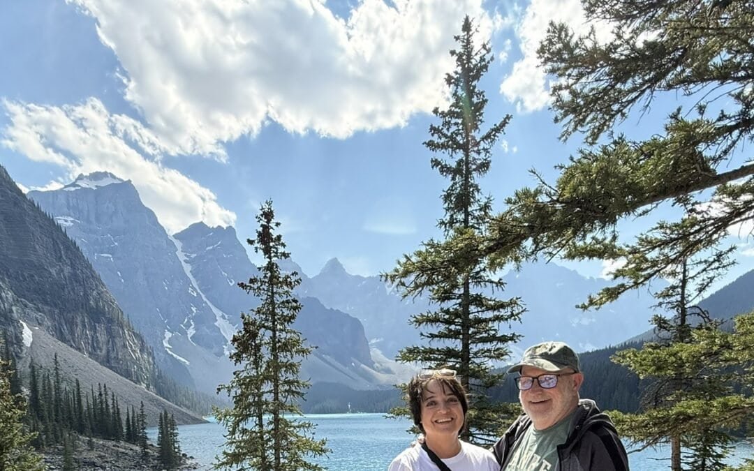Couple overlooking Moraine Lake and the Valley of the Ten Peaks in Banff