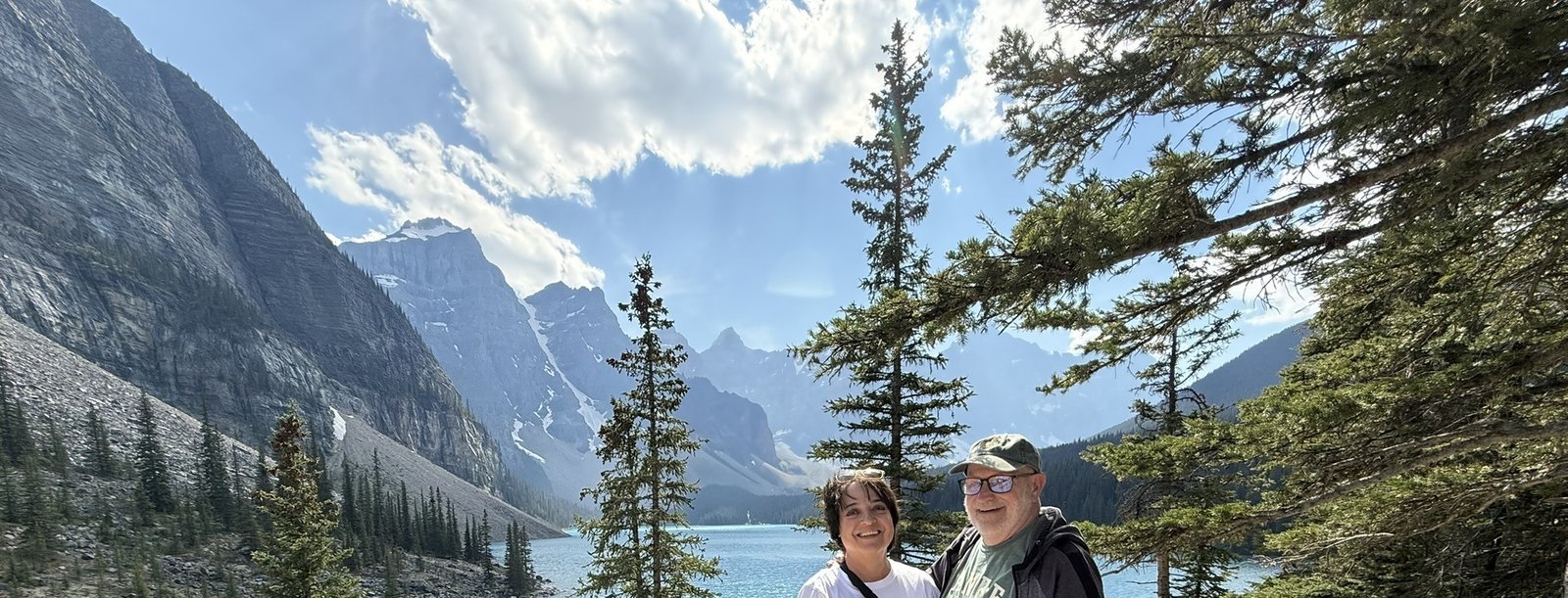 Couple overlooking Moraine Lake and the Valley of the Ten Peaks in Banff