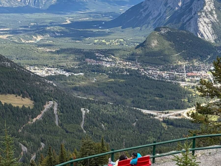 Parks Canada red chairs overlooking Banff from Mount Norquay