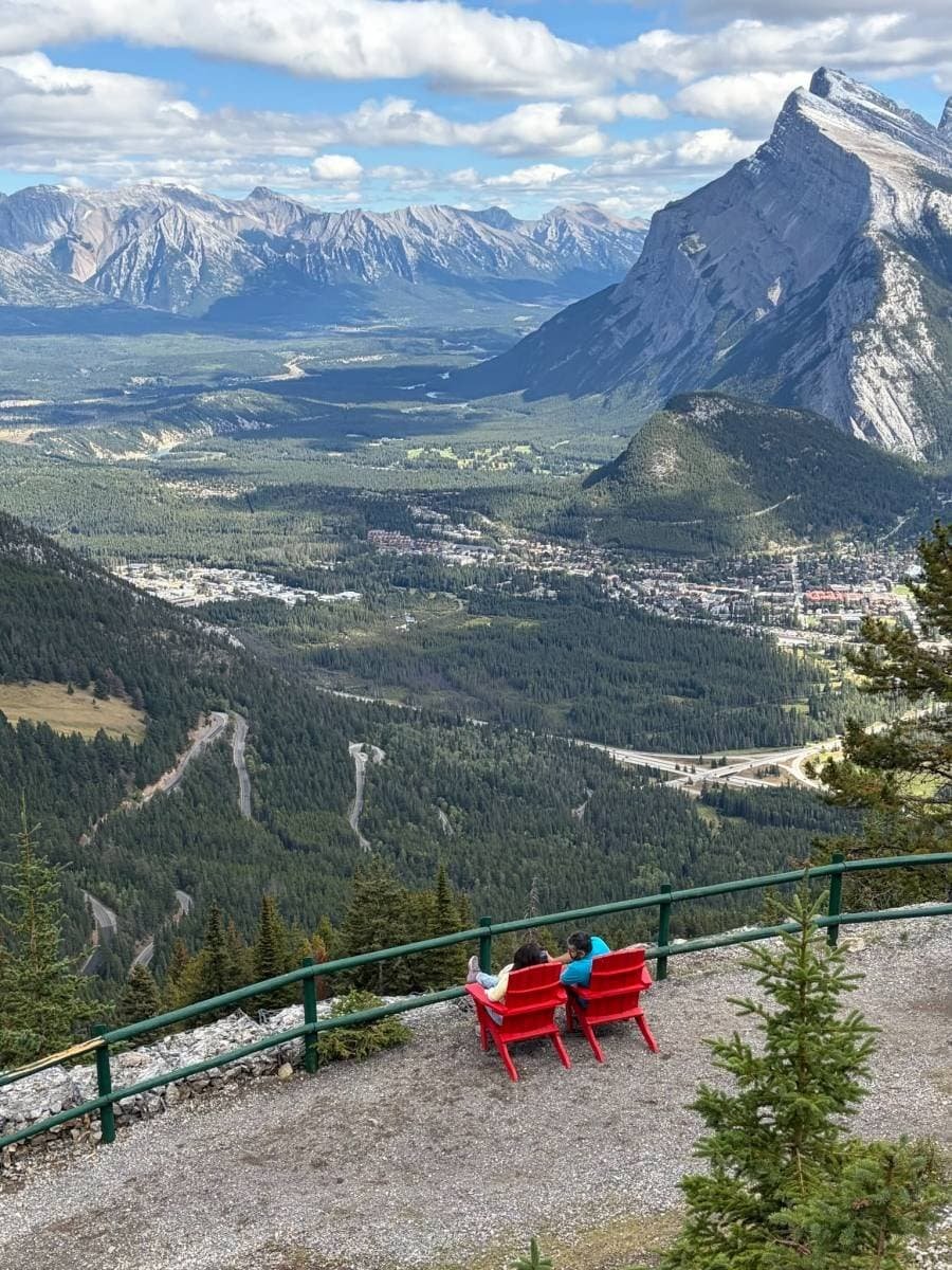 Parks Canada red chairs overlooking Banff from Mount Norquay