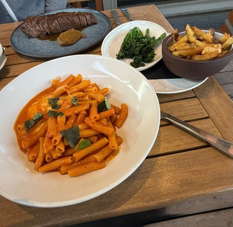 Bison steak, pasta, fries and vegetables at The Bison Restaurant in Banff