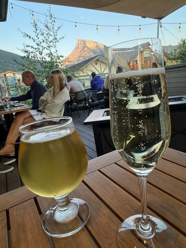 Beer and sparkling wine on The Bison rooftop patio in Banff